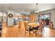 Bright kitchen with stainless steel appliances, an island, and an adjacent dining area with slider to patio at 30400 Hilltop Dr, Evergreen, CO 80439