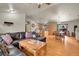 Open-concept living area with hardwood floors connecting to a kitchen, dining area and a cozy living room at 30400 Hilltop Dr, Evergreen, CO 80439