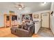 Inviting living room with a leather sectional, hardwood floors, and a large window with natural light at 30400 Hilltop Dr, Evergreen, CO 80439