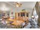 Spacious living room with hardwood floors, a large leather sectional, and adjacent dining area at 30400 Hilltop Dr, Evergreen, CO 80439