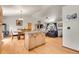 Open-concept living space with kitchen island, dining area, and inviting living room at 30400 Hilltop Dr, Evergreen, CO 80439