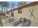 Outdoor patio with seating and lounge areas for relaxing and entertaining at 30400 Hilltop Dr, Evergreen, CO 80439