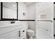 Updated bathroom with white vanity and fixtures at 8405 W 74Th Dr, Arvada, CO 80005