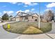 Corner lot home featuring a well-manicured lawn and mature tree at 8405 W 74Th Dr, Arvada, CO 80005