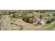Wide aerial view of a home with a pool, detached garage, and beautiful mature trees at 6871 S Himalaya Way, Centennial, CO 80016