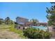 Large backyard featuring an in-ground pool, patio furniture, and mature trees at 6871 S Himalaya Way, Centennial, CO 80016