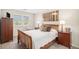 Comfortable bedroom features a warm color palette, natural light, and a serene atmosphere for rest and relaxation at 6871 S Himalaya Way, Centennial, CO 80016