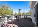 Cozy outdoor deck furnished with patio furniture, a grill, and a view of the expansive backyard at 6871 S Himalaya Way, Centennial, CO 80016