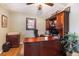 Well-appointed home office with custom built-ins, a large desk, and plenty of storage for all your needs at 6871 S Himalaya Way, Centennial, CO 80016