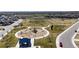 This is an aerial view showing the neighborhood playground, open green space, and walking trails at 13485 Niagara St, Thornton, CO 80602