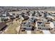 A beautiful neighborhood featuring neatly landscaped yards, fenced perimeters, and houses with solar panels at 13485 Niagara St, Thornton, CO 80602