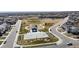 This is an aerial view showing the neighborhood playground, sports court, and open green space at 13485 Niagara St, Thornton, CO 80602