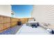 Private backyard retreat featuring a modern hot tub, concrete patio, and wooden privacy fence at 13485 Niagara St, Thornton, CO 80602