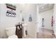 Cozy powder room featuring a pedestal sink, unique decor, and stylish fixtures, offering a blend of charm and functionality at 13485 Niagara St, Thornton, CO 80602