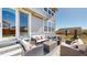 Inviting outdoor patio features stylish wicker furniture, perfect for relaxing and entertaining at 13485 Niagara St, Thornton, CO 80602