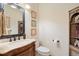 Elegant bathroom with ornate vanity and decorative shelving at 25 Long Bow Cir, Monument, CO 80132