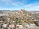 An aerial view of homes near a beautiful mountain offering unique scenery and landscapes at 717 Anderson St, Castle Rock, CO 80104