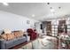 Cozy basement area featuring a comfortable seating arrangement, wood-look flooring, and recessed lighting at 717 Anderson St, Castle Rock, CO 80104