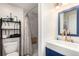 Bathroom features a modern sink, elegant faucet, shower, and convenient shelving at 717 Anderson St, Castle Rock, CO 80104