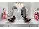 Charming bathroom featuring dual vessel sinks, modern fixtures, and oval mirrors at 717 Anderson St, Castle Rock, CO 80104