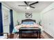 Serene bedroom with ample natural light, hardwood floors, and ceiling fan, creating a tranquil and inviting retreat at 717 Anderson St, Castle Rock, CO 80104