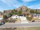 Charming home featuring a two-car garage and modern solar panels, nestled against a beautiful rock formation at 717 Anderson St, Castle Rock, CO 80104