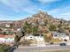 Beautiful house showcasing an attached garage and solar panels, all set against a striking mountain backdrop at 717 Anderson St, Castle Rock, CO 80104