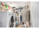A compact laundry room with a washer, dryer, and storage shelves at 717 Anderson St, Castle Rock, CO 80104