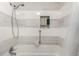 Elegant shower features a handheld sprayer, tile surround, and a built-in niche at 717 Anderson St, Castle Rock, CO 80104
