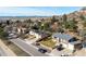 An aerial shot of a house on a street, surrounded by lush trees, offering a serene and private setting at 717 Anderson St, Castle Rock, CO 80104