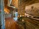 Hallway featuring hardwood floors, stone accents, and artistic decor at 10111 Inverness Main St # 223, Englewood, CO 80112