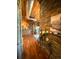 Hallway featuring hardwood floors, stone accents, and artistic decor at 10111 Inverness Main St # 223, Englewood, CO 80112
