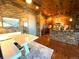Inviting kitchen and dining area featuring stone accents and modern lighting at 10111 Inverness Main St # 223, Englewood, CO 80112