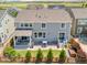 Aerial view of the home's backyard featuring a patio, fenced yard, and lush lawn at 14565 Vancouver Pl, Parker, CO 80134