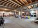 Unfinished basement with exposed ceiling, concrete floors, and ample space for customization at 14565 Vancouver Pl, Parker, CO 80134