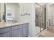 Well-lit bathroom with a sleek vanity, modern shower, and stylish decor, offering a spa-like experience at 14565 Vancouver Pl, Parker, CO 80134