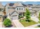 Charming home featuring solar panels, manicured lawn, and welcoming curb appeal at 14565 Vancouver Pl, Parker, CO 80134