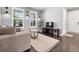 Comfortable living room with bright windows, modern lighting, and stylish decor for relaxing at 14565 Vancouver Pl, Parker, CO 80134