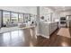 Open-concept living space featuring hardwood floors, modern décor, and bright natural light at 14565 Vancouver Pl, Parker, CO 80134