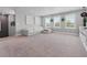 Large living room featuring a comfortable sectional sofa, neutral tones and bright natural light at 14565 Vancouver Pl, Parker, CO 80134