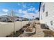 Landscaped backyard featuring a charming garden bed and a view of the neighborhood at 6454 Leathers Ln, Parker, CO 80134
