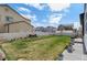 Spacious backyard with a well-maintained lawn and a white fence, perfect for outdoor activities at 6454 Leathers Ln, Parker, CO 80134