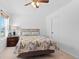 Comfortable bedroom with a large window, neutral walls, plush carpet and complemented by stylish furniture at 6454 Leathers Ln, Parker, CO 80134