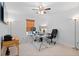 Well-lit office space featuring a glass desk, comfortable chair, and bright natural light at 6454 Leathers Ln, Parker, CO 80134