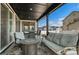 Inviting covered outdoor patio with comfortable seating, perfect for relaxing or entertaining guests at 6454 Leathers Ln, Parker, CO 80134