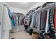 Spacious walk-in closet with plenty of hanging space for clothes and storage for other belongings at 6454 Leathers Ln, Parker, CO 80134