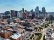 Drone shot showcasing the building and surrounding city at 1499 Blake St # 4O, Denver, CO 80202