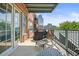 Private balcony with city views and outdoor seating at 1499 Blake St # 4O, Denver, CO 80202