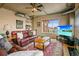 Living room with fireplace, leather sofas, and hardwood floors at 1499 Blake St # 4O, Denver, CO 80202