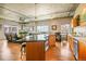 Open-concept living room with hardwood floors, modern kitchen, and large windows offering city views at 1499 Blake St # 4O, Denver, CO 80202